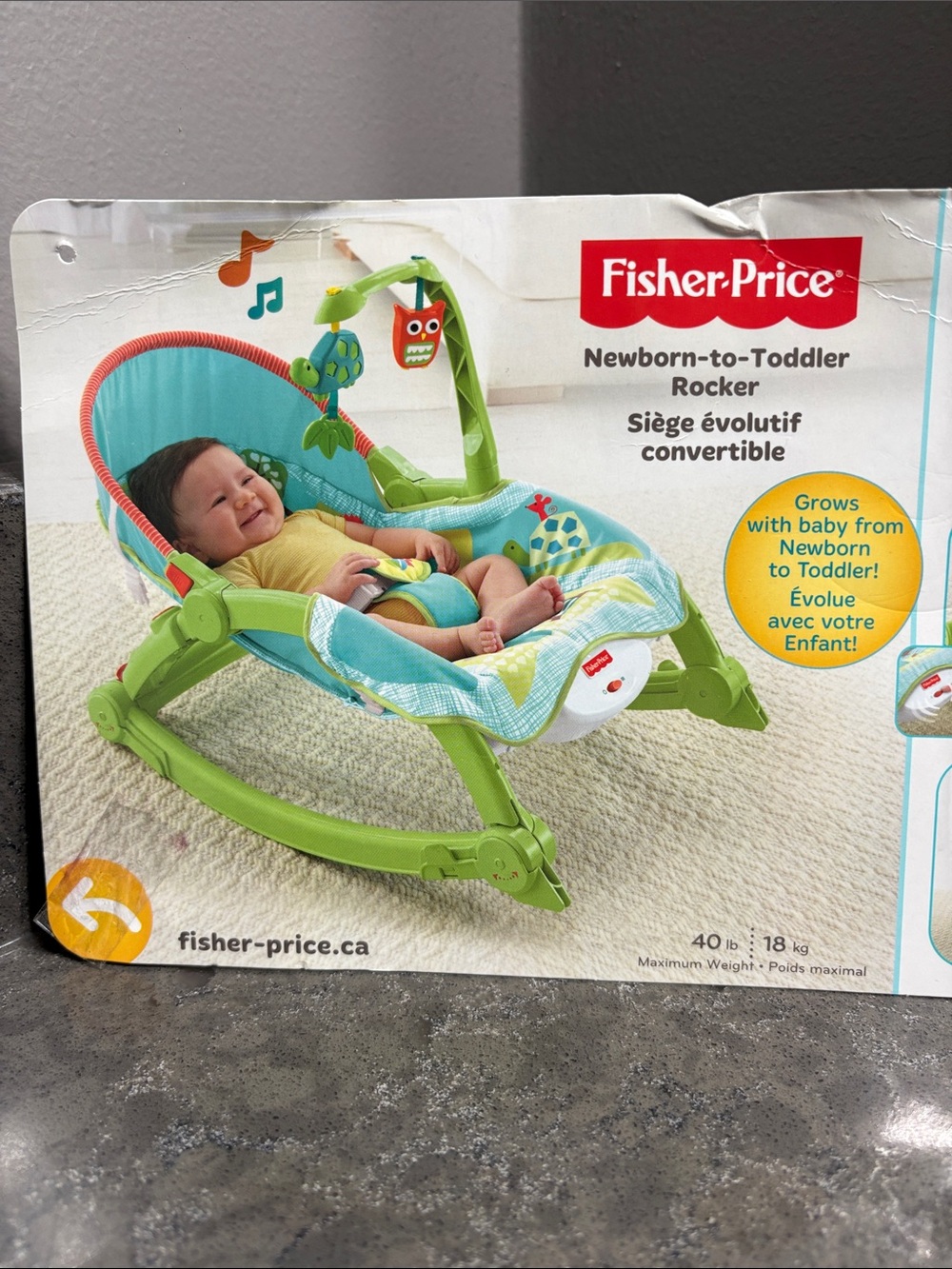 Fisher-Price  Newborn-to-Toddler Rocker with Toy Bar. Never been assembled.